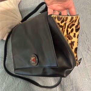 Kate Spade is Black Leather Bag with Leopard Print Accent
